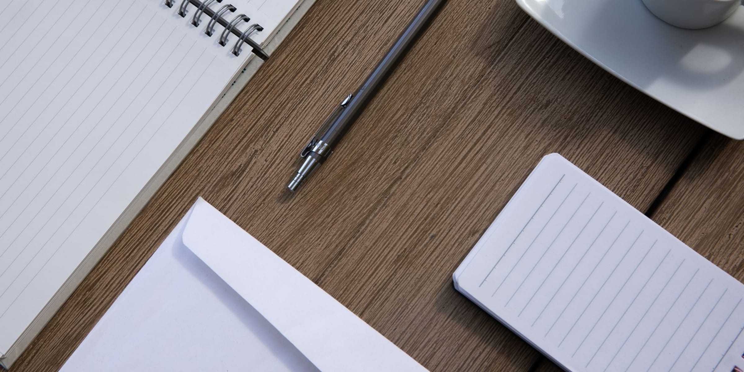 A calm, tidy desk in soft morning light — a quiet, methodical workspace